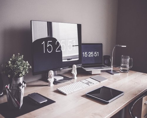 Proper desk setup with laptop and external monitor